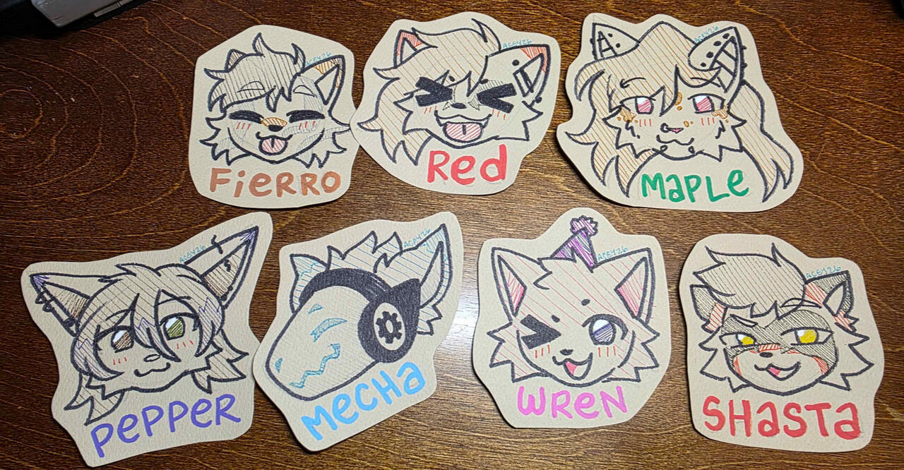 Photo of a bunch of badge art before it has been laminated! Photo of a bunch of badge art before it has been laminated!